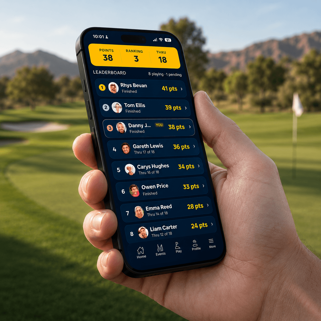 A golfer holding a phone showing the live tournament leaderboard on the course