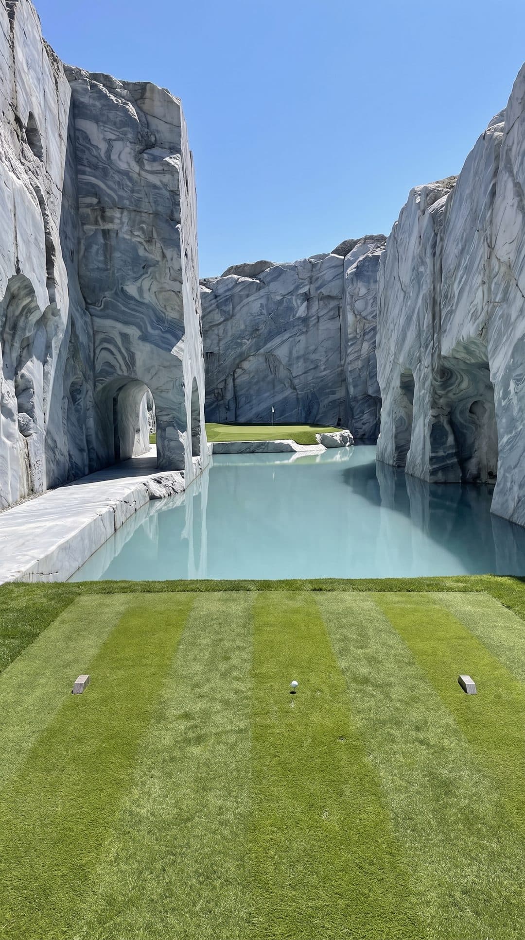 AI-imagined golf hole: a par 3 played at water level down a gorge of swirling blue and white marble
